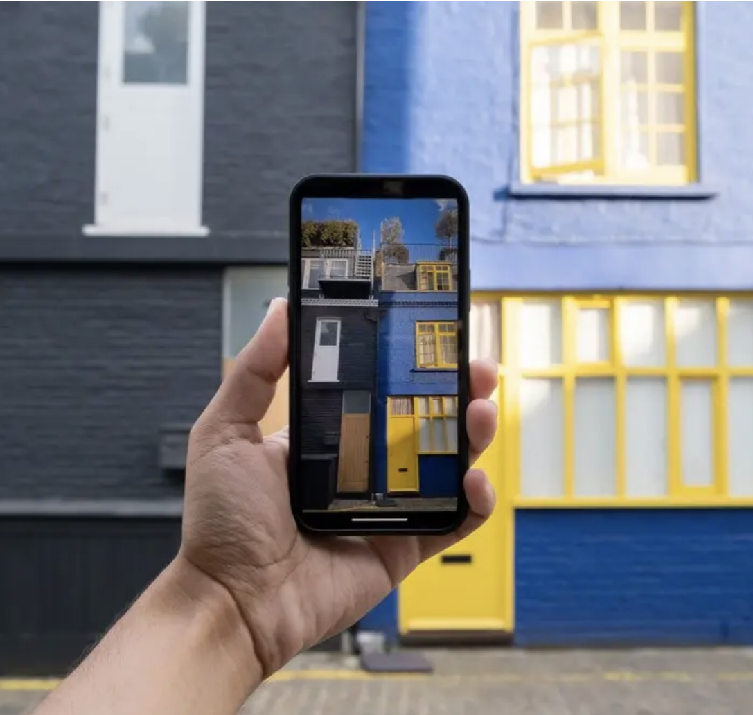 A person scans a home for a virtual tour.
